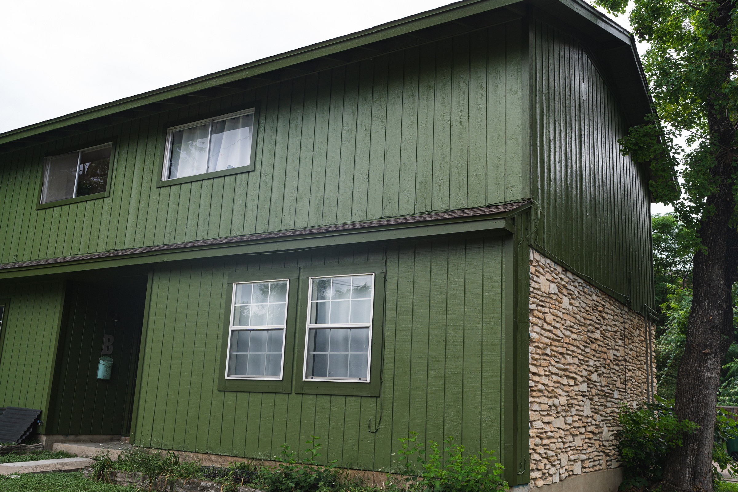 Exterior repaint in deep forest green, Austin, TX